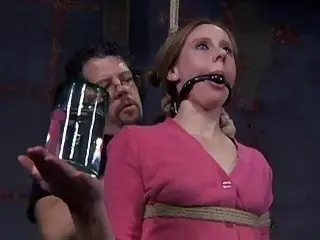 Cute gagged and bound woman feels the extreme pain BDSM
