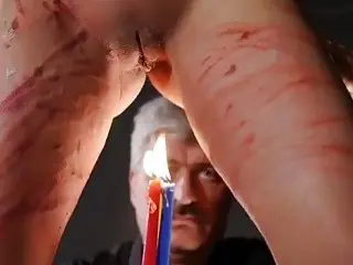 Redhead gets whipped and teased with some candles as well